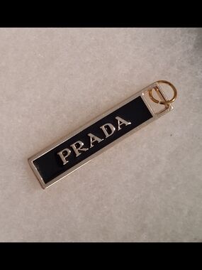 Prada Black and Gold Rectangular Charm